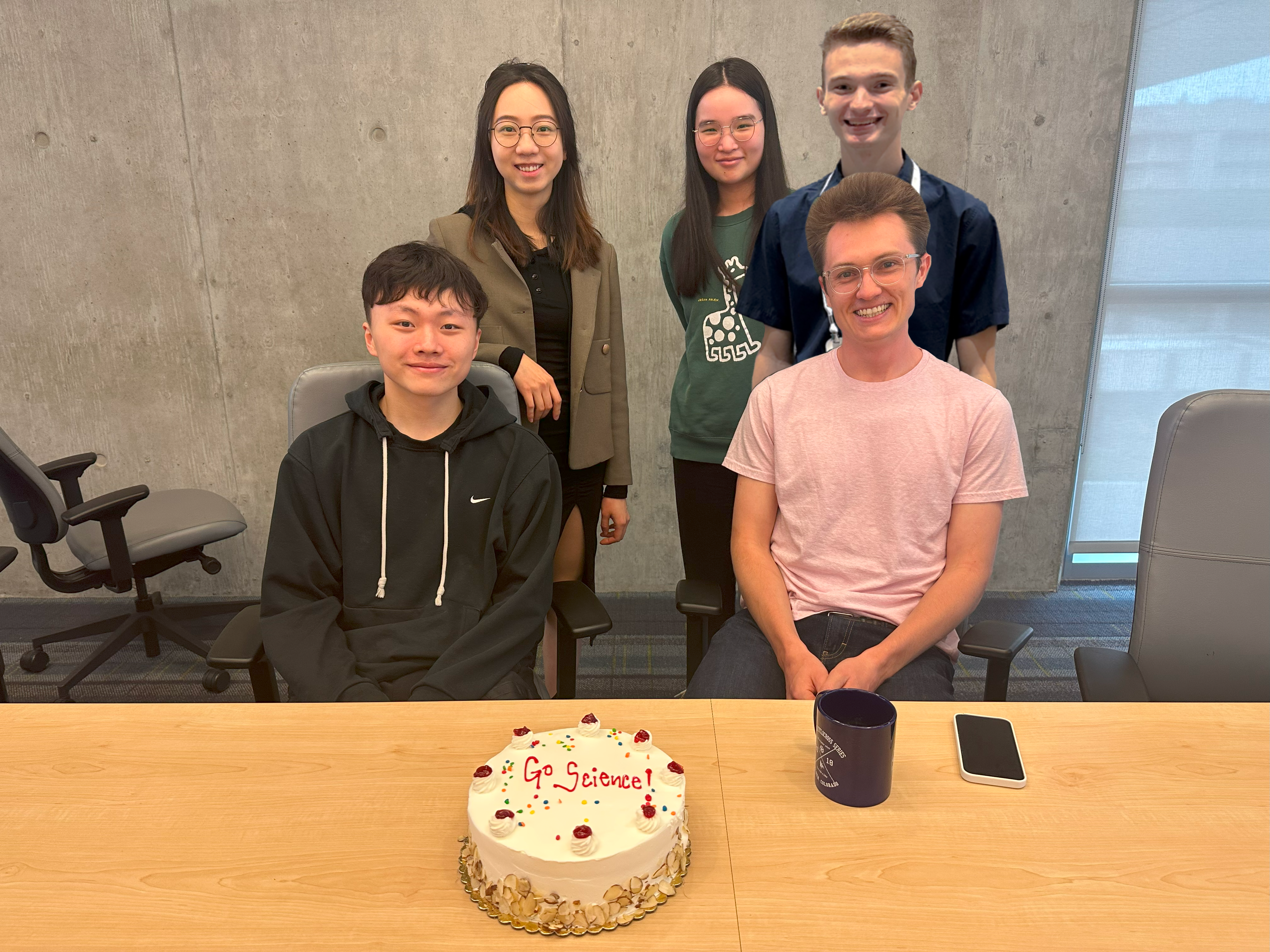 015 bvl team members enjoying a cake to celebrate their successful neur IP s submissions